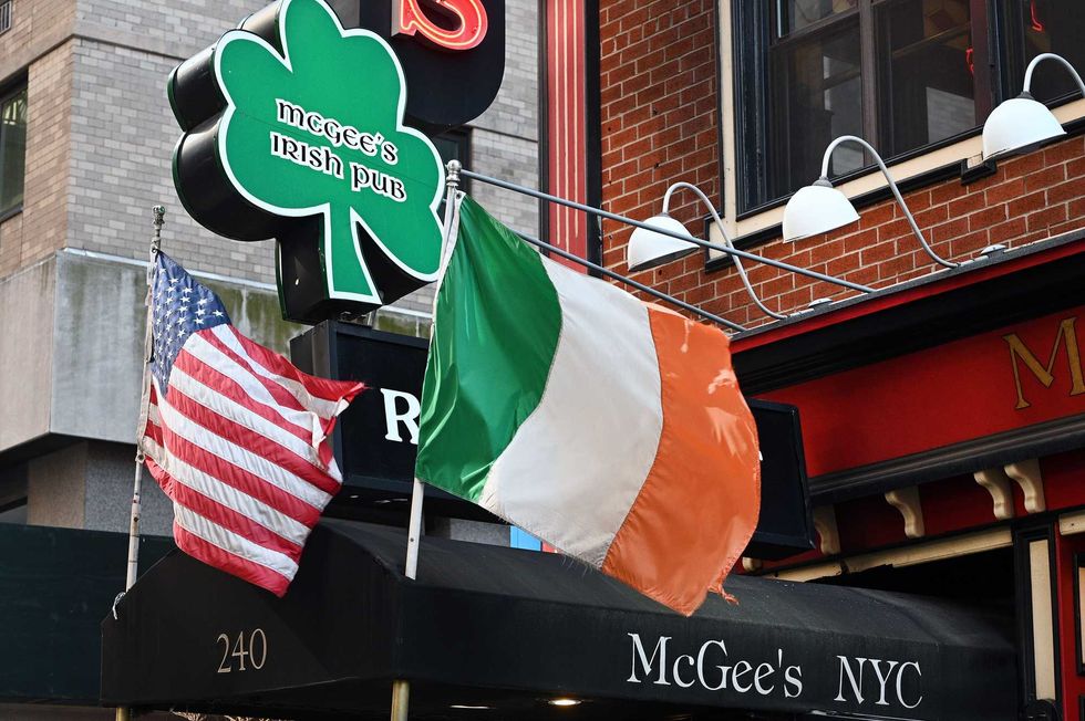 The American and Irish flag flutter in a breeze as McGee