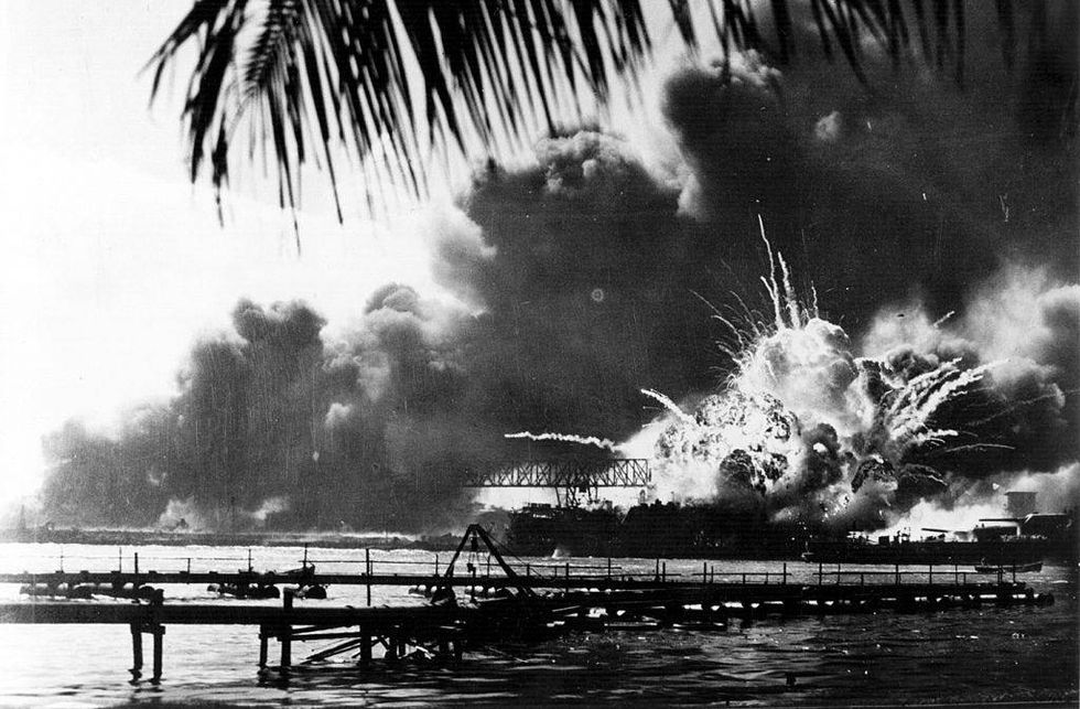 The American destroyer USS Shaw explodes during the Japanese attack on Pearl Harbor, home of the American Pacific Fleet during World War II, December 7, 1941.