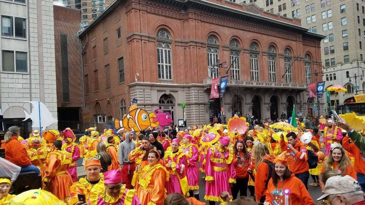 The annual Mummers Parade is in full swing on a surprisingly warm but windy New Year's Day.