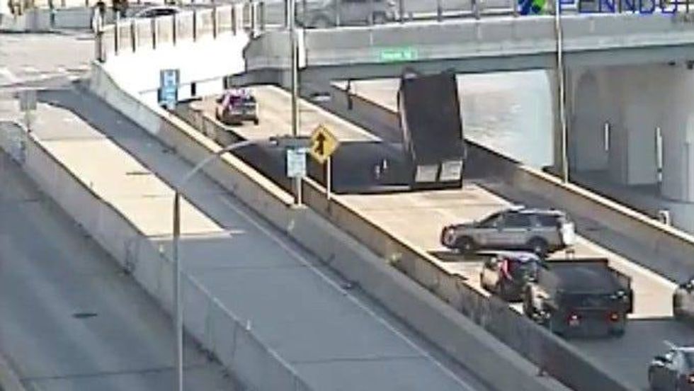 The back end of a truck wedged under the South Street overpass snarled traffic on the Schuylkill Expressway on Monday morning.