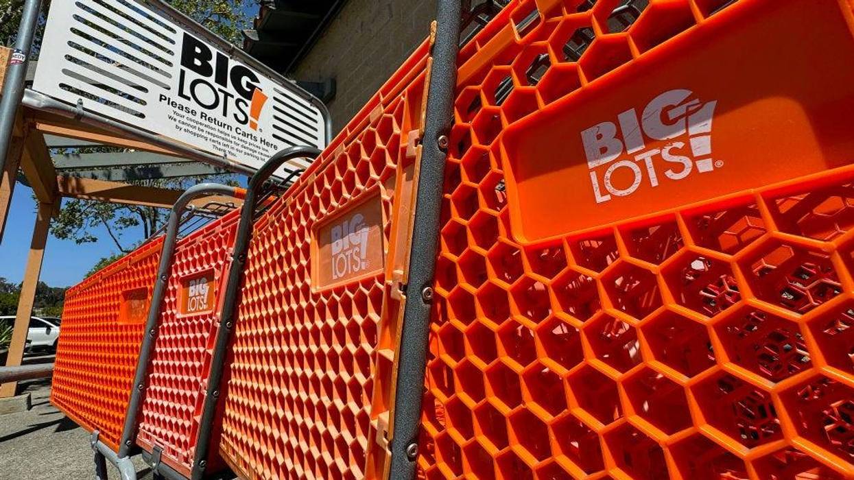 The Big Lots logo is displayed on shopping carts in front of a Big Lots store