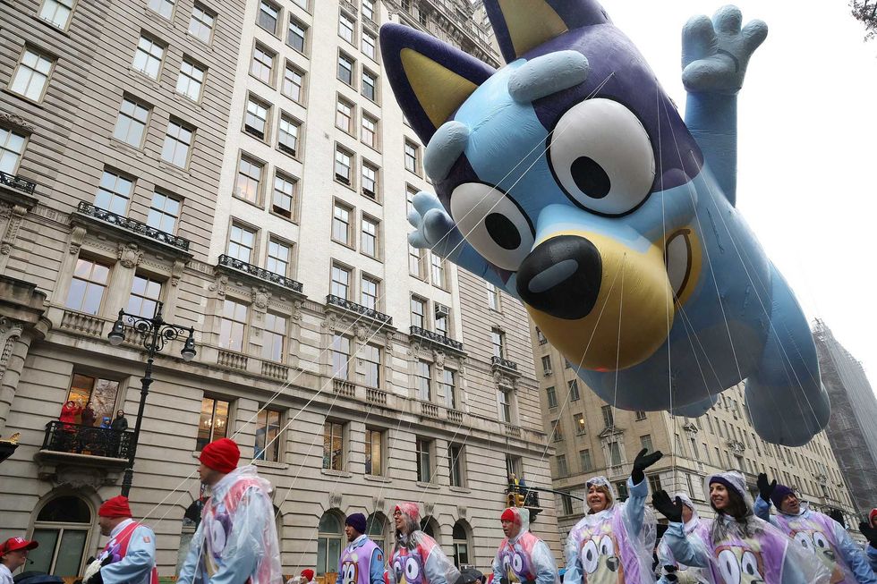 The Bluey balloon team march during the Annual Thanksgiving Day Parade on November 28, 2024 in New York City. This is the 98th Macy