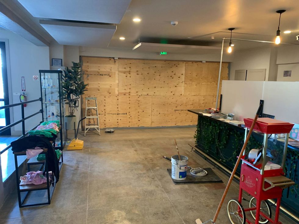 The boarded up space where a car rammed into Ivy Hill.