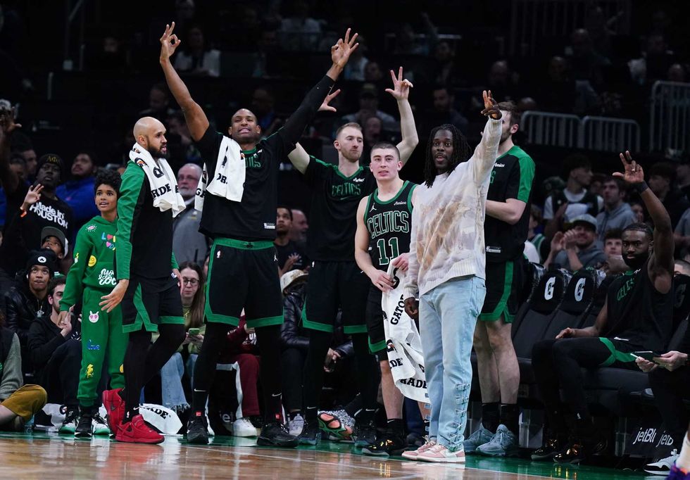 The Boston Celtics bench reacts after a three point basket against the Indiana Pacers in the second half at TD Garden.