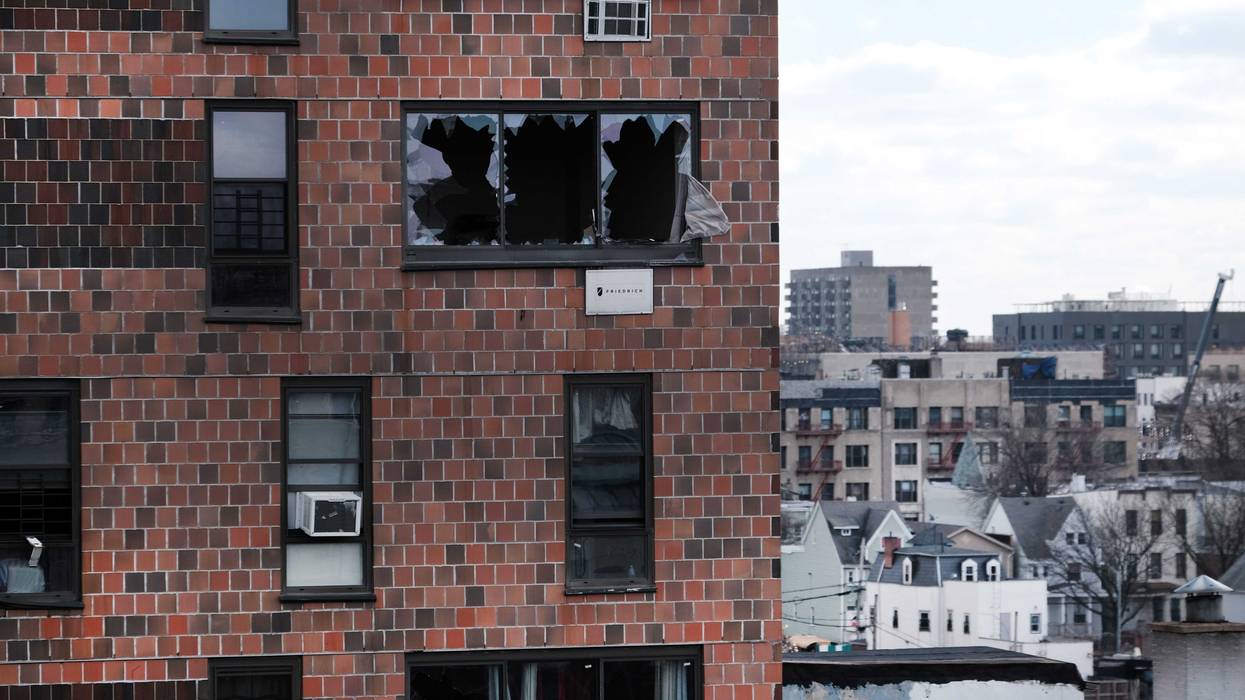 The Bronx apartment building stands a day after a fire swept through the complex killing at least 17 people and injuring dozens of others, many of them seriously on January 10, 2022 in New York City. The five-alarm NYC fire began around 11 am Sunday when a space heater caught fire inside of a duplex apartment on the 2nd and 3rd floors of the 19-story apartment building.