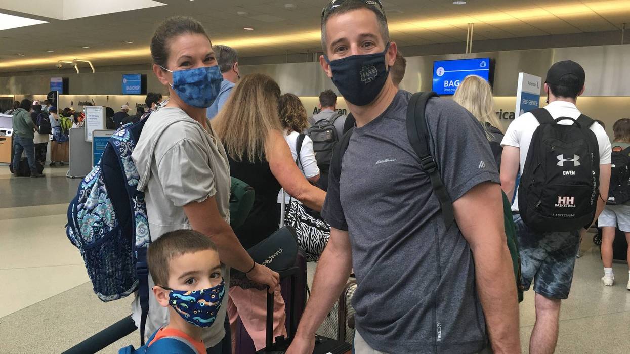 The Brooks family prepares to board their flight and visit grandparents at Philadelphia International Airport.