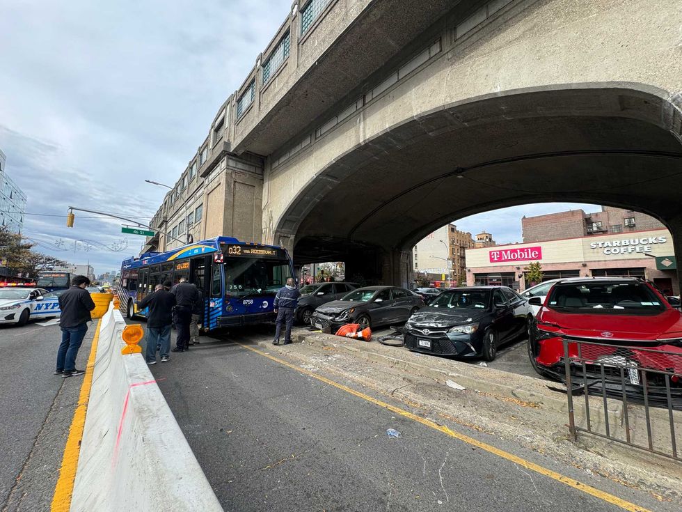 The bus crashed into several cars parks under the elevated 7 train platform and fences in the area.
