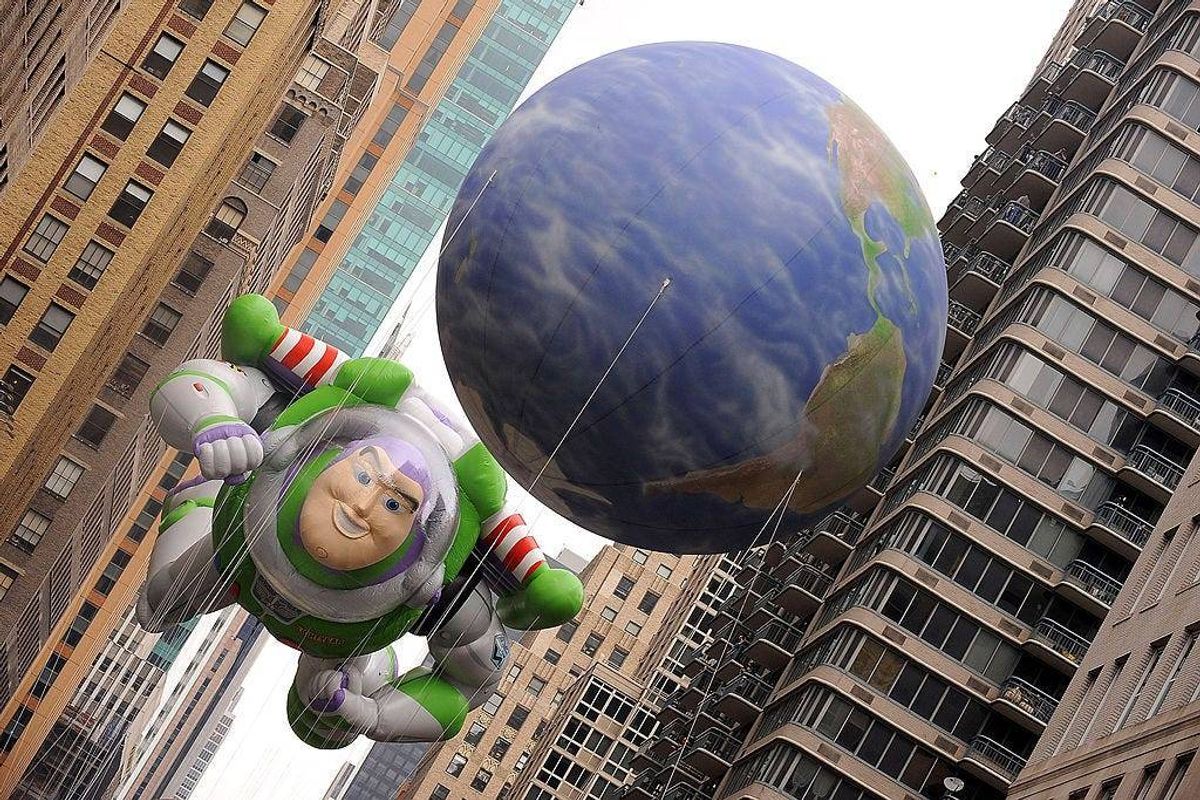 The Buzz Lightyear balloon hovers in between Manhattan high rises during the 83rd annual Macy's Thanksgiving Day parade on the Streets of Manhattan on November 26, 2009 in New York City.
