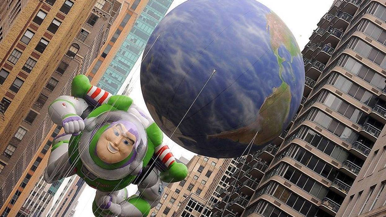The Buzz Lightyear balloon hovers in between Manhattan high rises during the 83rd annual Macy's Thanksgiving Day parade on the Streets of Manhattan on November 26, 2009 in New York City.