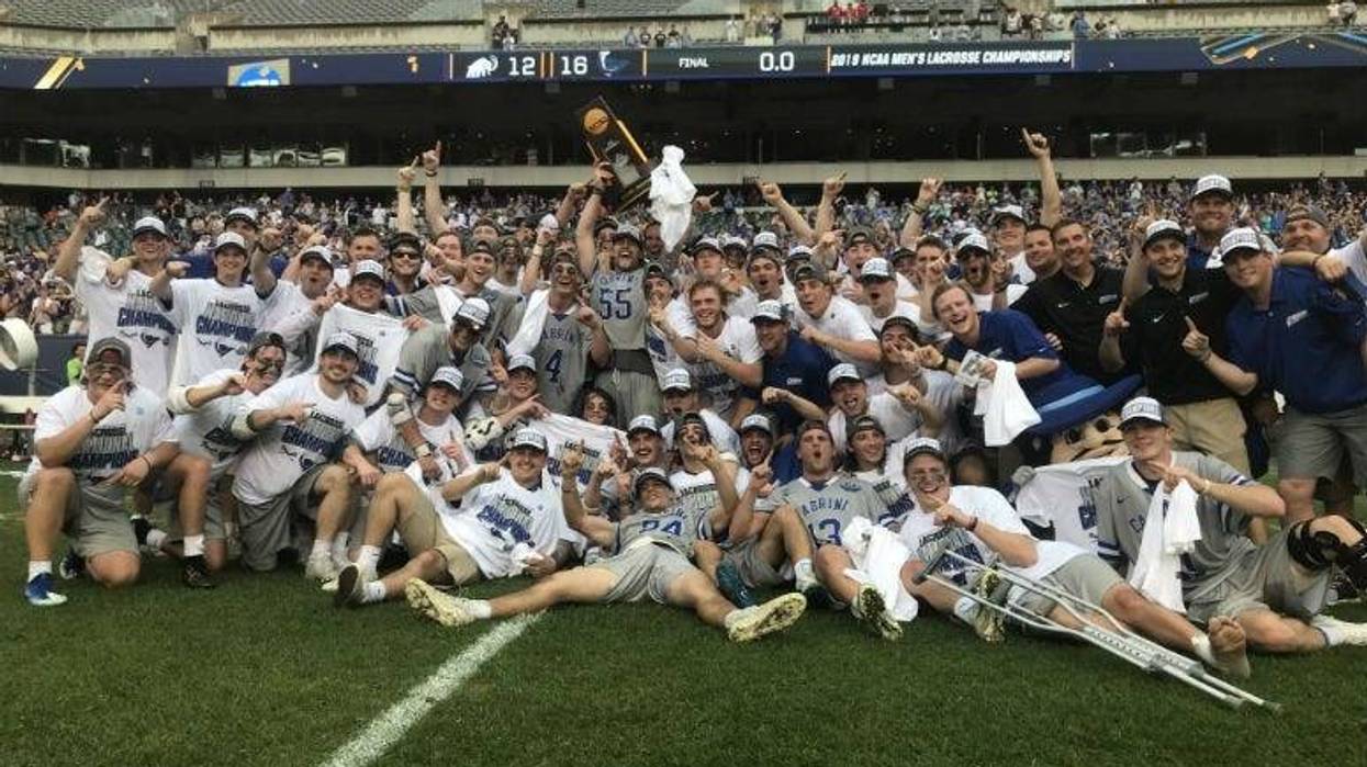 The Cabrini University men's lacrosse team celebrates its first national title at the Linc on Sunday.