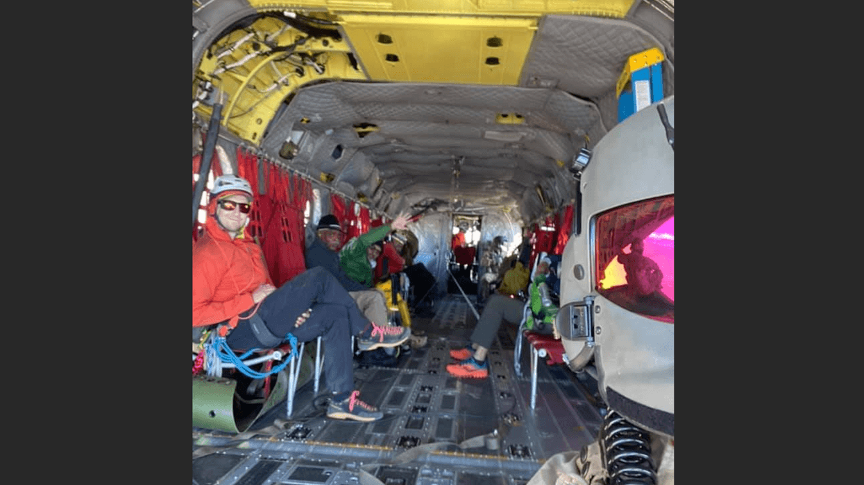 The California National Guard and the three rescued three hikers stranded after they were picked up near the summit of Mt. Whitney on Tuesday morning.
