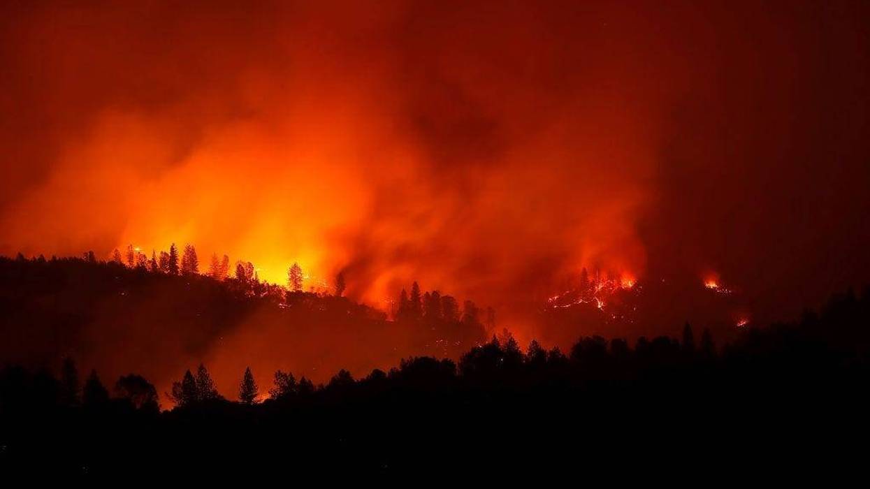 The Camp Fire burns in the hills on November 11, 2018 near Oroville, California