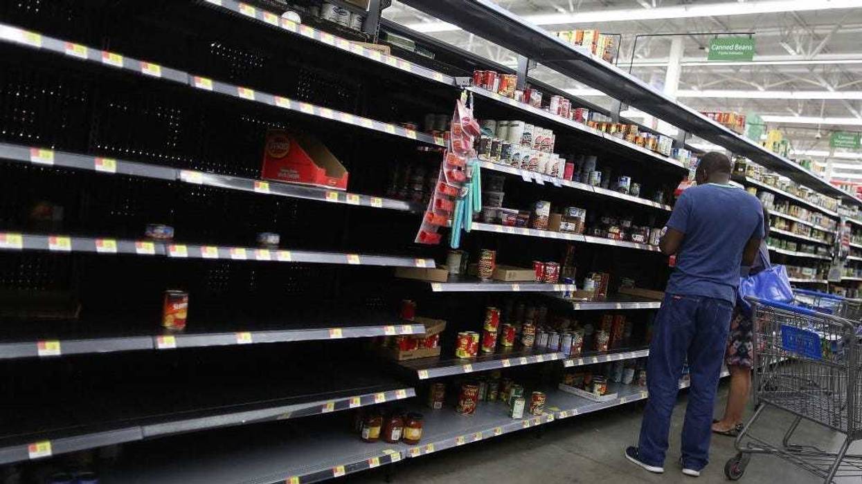 The canned foods section of a Walmart store is almost empty as people prepare for the possible arrival of Hurricane Harvey on August 24, 2017 in Houston, Texas