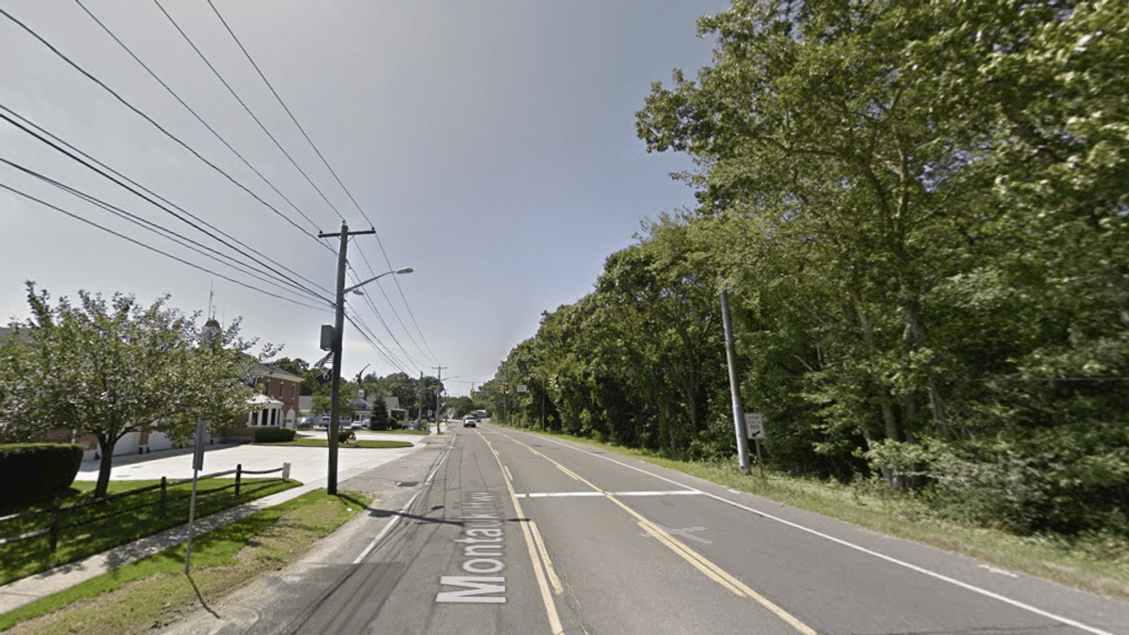 The car crashed into a utility pole at Montauk Highway and Carman Boulevard in Brookhaven shortly before 8 p.m. Thursday