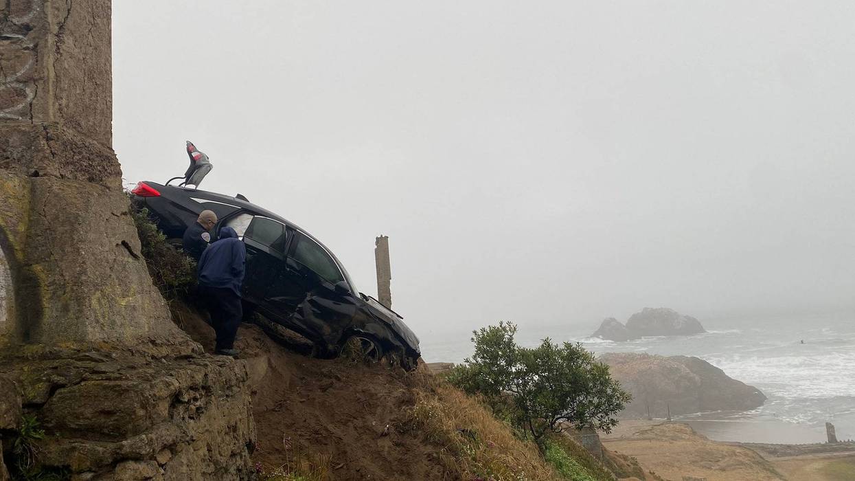 The car dove headfirst off the cliff and fell 40 feet.