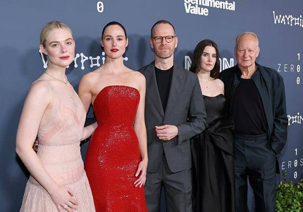 The cast and director of Sentimental Value pose on the red carpet at the movie