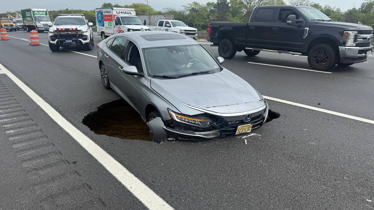 Monster sinkhole swallows car on LIE, sends other drivers skidding out of control