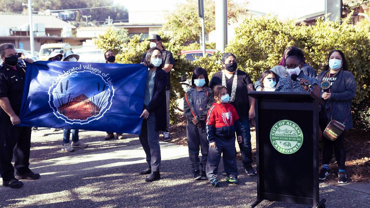 The city of Albany unveils the flag of the Confederated Villages of Lisjan at city hall on Oct. 11, 2021.