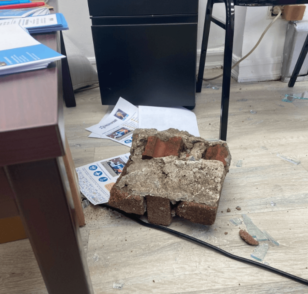 The cluster of bricks that was used to smash the window.