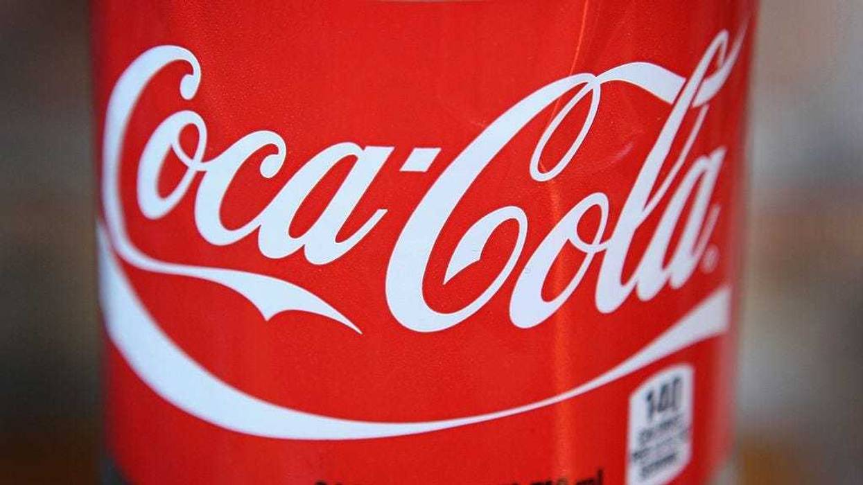 The Coca-Cola logo is printed on the label of a 24-ounce bottle of soda on April 17, 2012 in Chicago, Illinois.