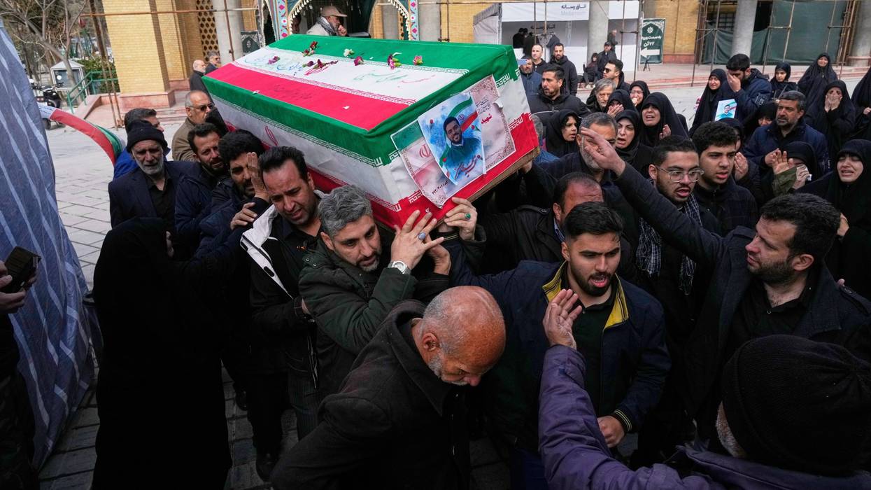 The coffin of Mehdi Hosseini, a man killed in a U.S.-Israeli strike, is carried for burial at Behesht-e Zahra cemetery in Tehran, Iran, Monday, March 9, 2026.