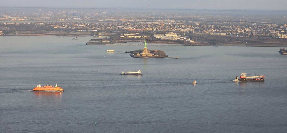 The Concorde is seen near the Statue of Liberty on March 14, 2024