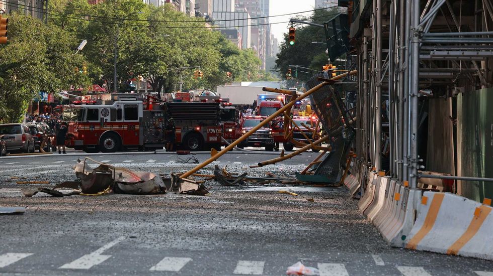 The crane boom and 16 tons of concrete fell around 50 stories to the street below