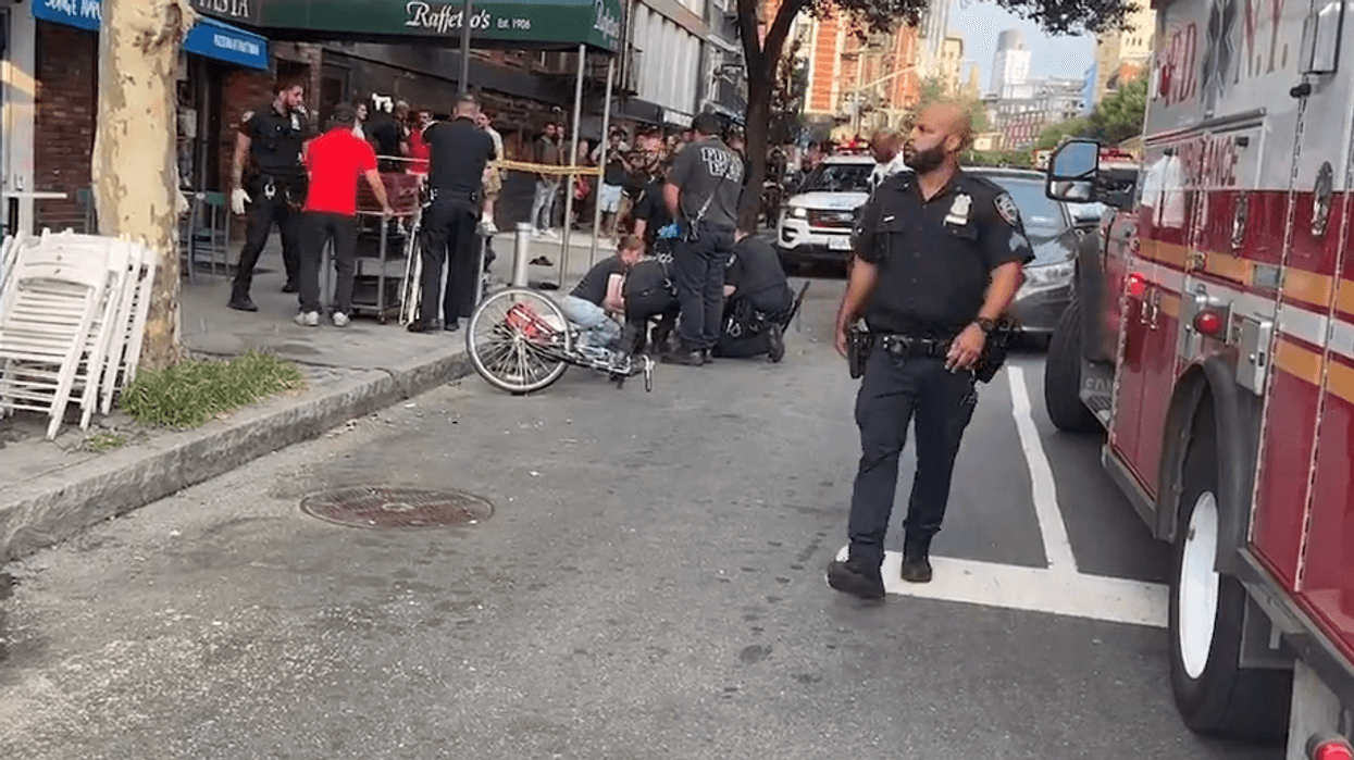 The cyclist was struck by the Mercedes driver at Houston and Sullivan streets