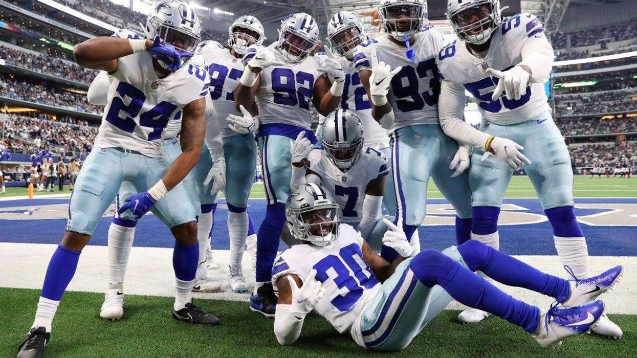 The Dallas Cowboys celebrate an interception by Trevon Diggs #7 of the Dallas Cowboys against the Atlanta Falcons during the third quarter at AT&T Stadium on November 14, 2021 in Arlington, Texas.