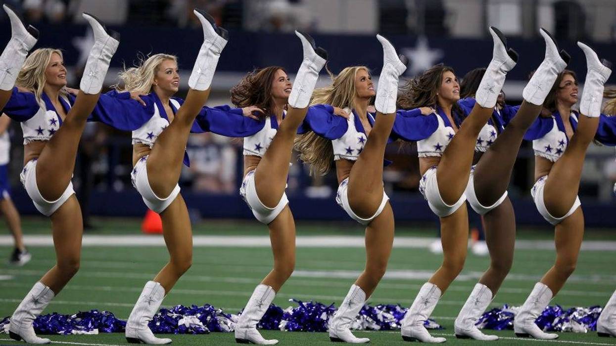 The Dallas Cowboys Cheerleaders perform before the Dallas Cowboys take on the Houston Texans in a preseason NFL game at AT&T Stadium on August 21, 2021 in Arlington, Texas.