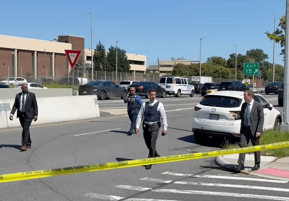 The detective was shot in the area of 22nd Road and the Whitestone Expressway service road