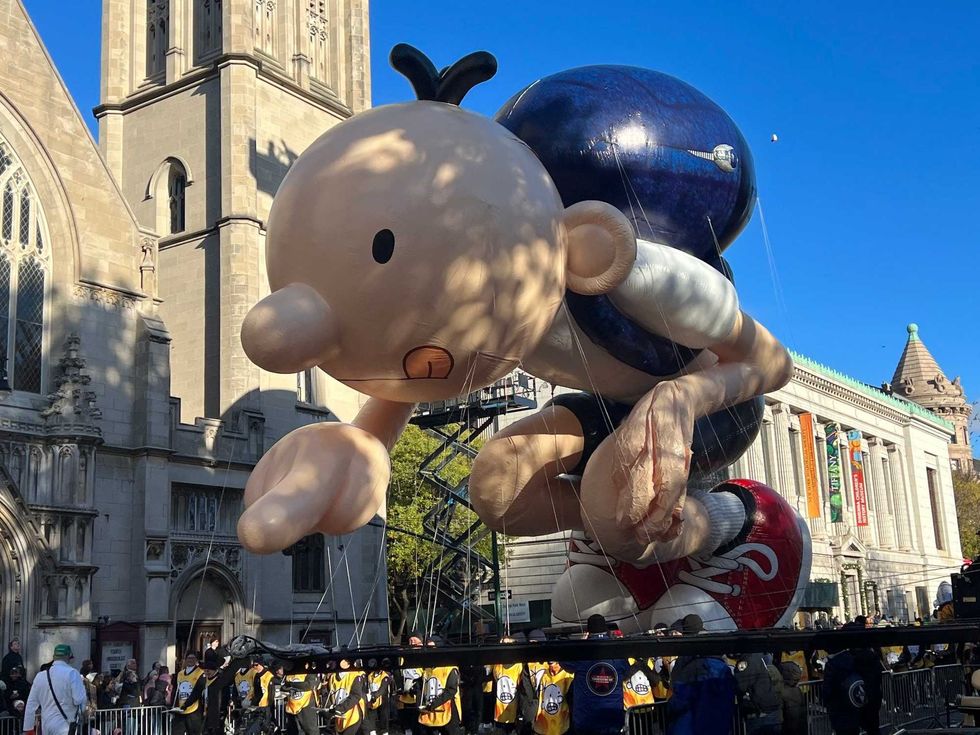 The Diary of a Wimpy Kid balloon floats at the Macy