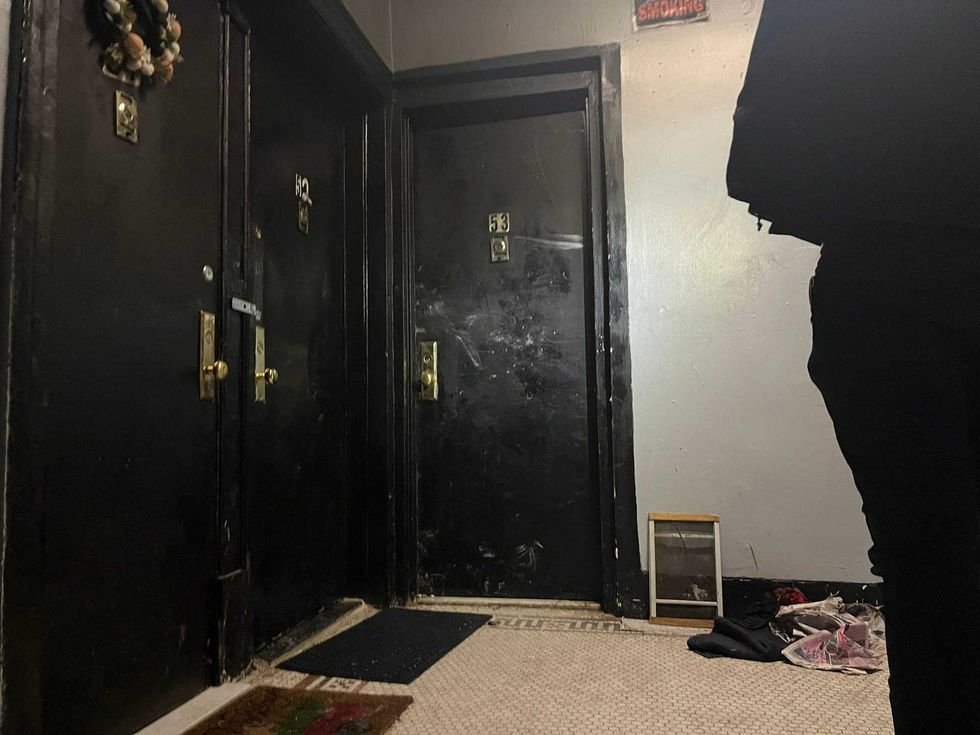 The door to the fifth-floor apartment where the fire broke out