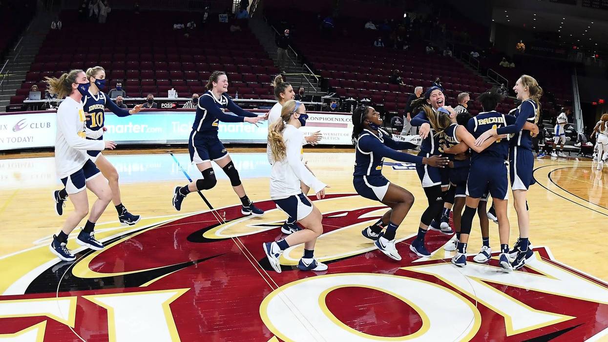 The Drexel women's basketball team celebrates its CAA title.