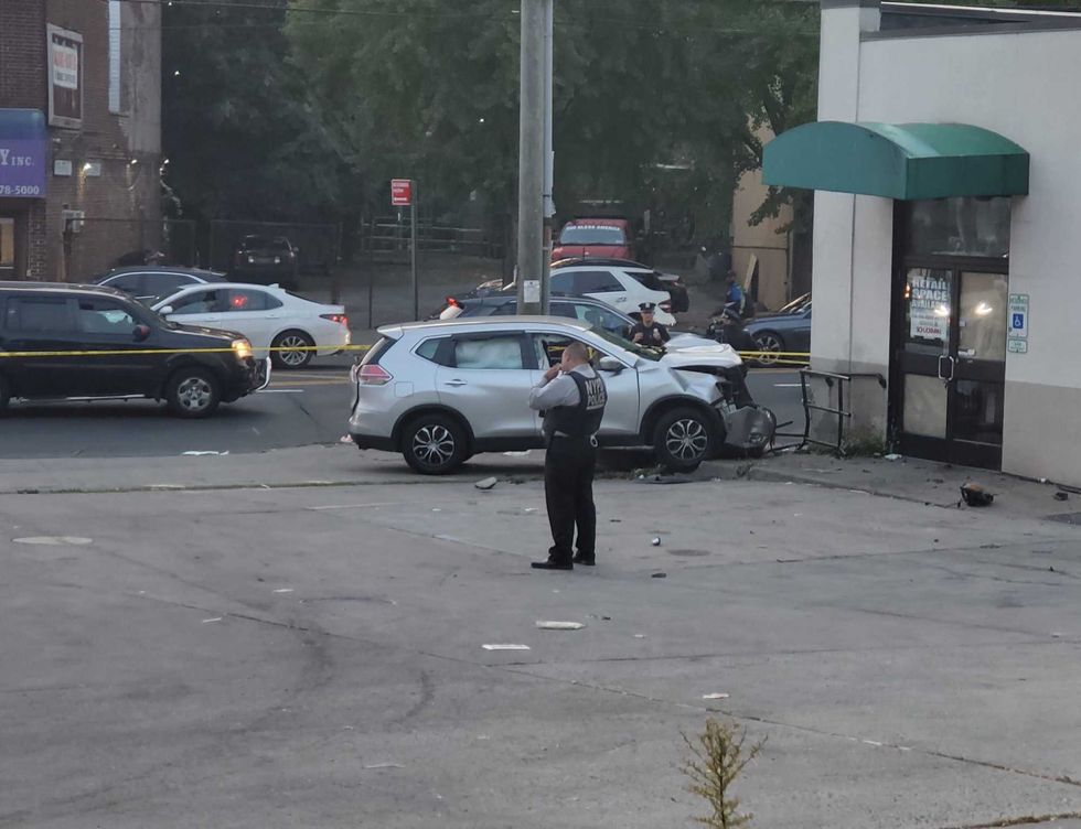 The driver struck a woman and mounted a sidewalk after being shot in the head, police said