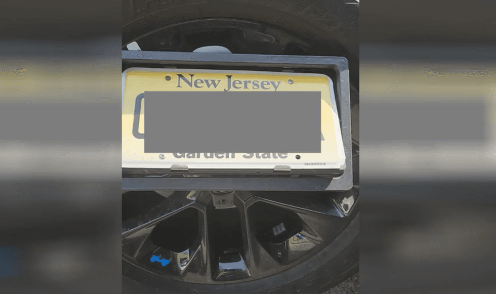 The electronic device flipped the license plate in order to conceal it at the toll plaza, police said