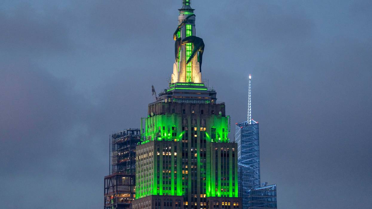 The Empire State Building is lit in green with a giant inflatable green dragon to mark the new season of Max/HBO's series "House of the Dragon" on June 16, 2024