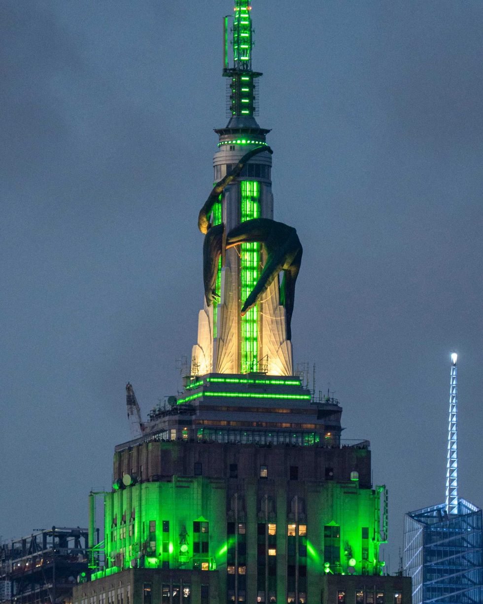 The Empire State Building is lit in green with a giant inflatable green dragon to mark the new season of Max/HBO