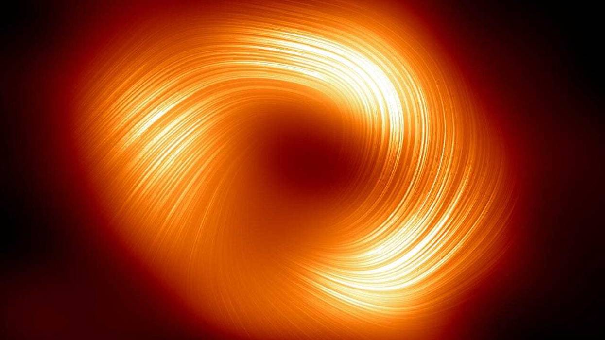 "The Event Horizon Telescope (EHT) collaboration, who produced the first ever image of our Milky Way black hole released in 2022, has captured a new view of the massive object at the centre of our Galaxy: how it looks in polarised light. This is the first time astronomers have been able to measure polarisation, a signature of magnetic fields, this close to the edge of Sagittarius A*. This image shows the polarised view of the Milky Way black hole. The lines overlaid on this image mark the orientation of polarisation, which is related to the magnetic field around the shadow of the black hole."