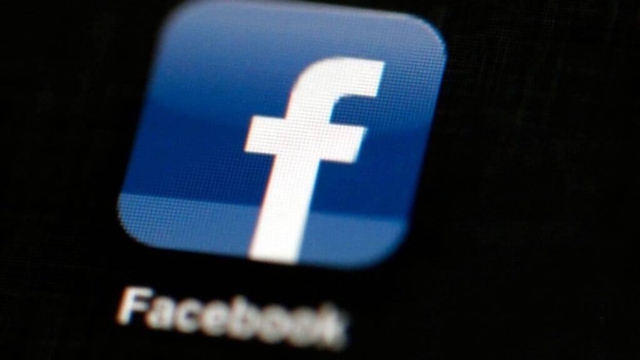 the Facebook logo is displayed on an iPad