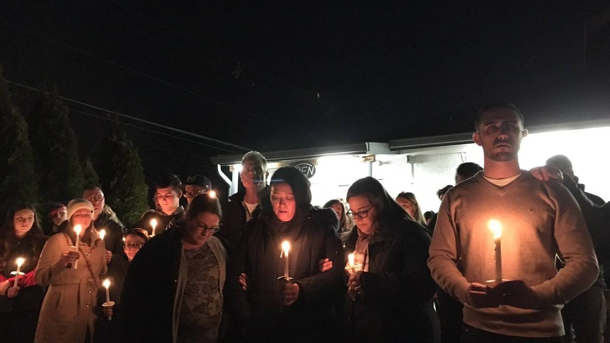 The family of Jerry Pastore lead a vigil for the owner of Shamrock Deli, in Audubon, Camden County.