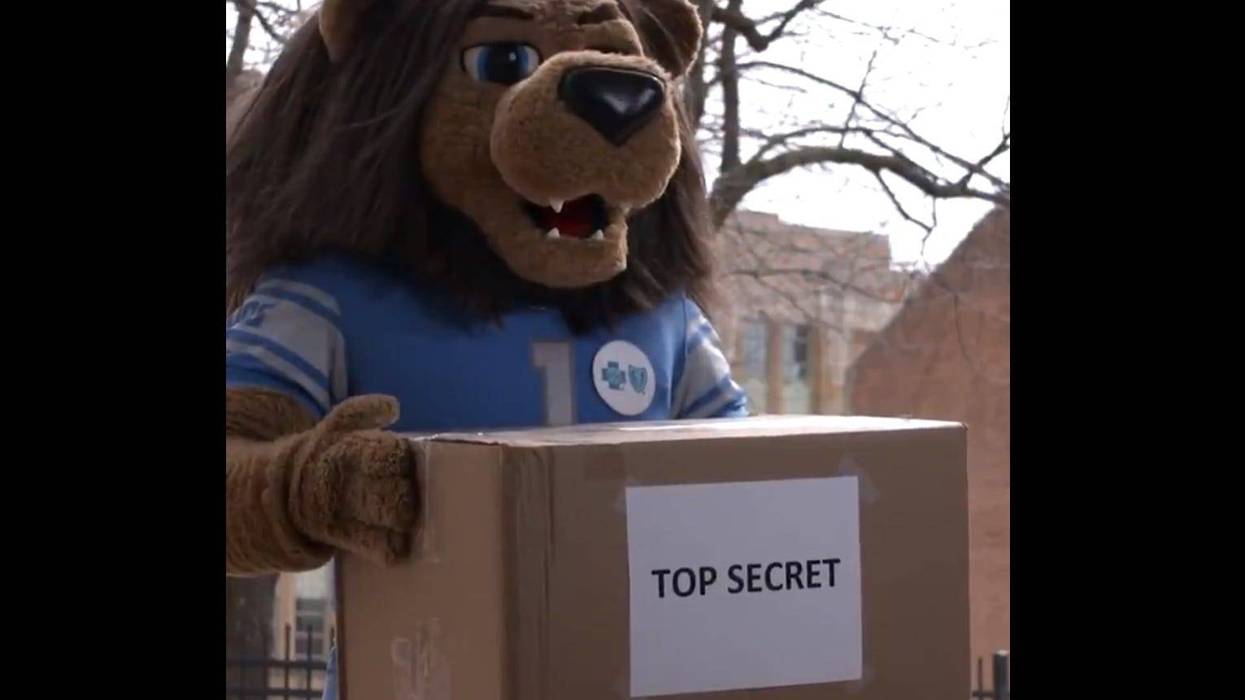 The fans want to know — what is in the box marked "top secret" that Rory the Lion was seen holding on the Detroit Lions' social media page the other day?