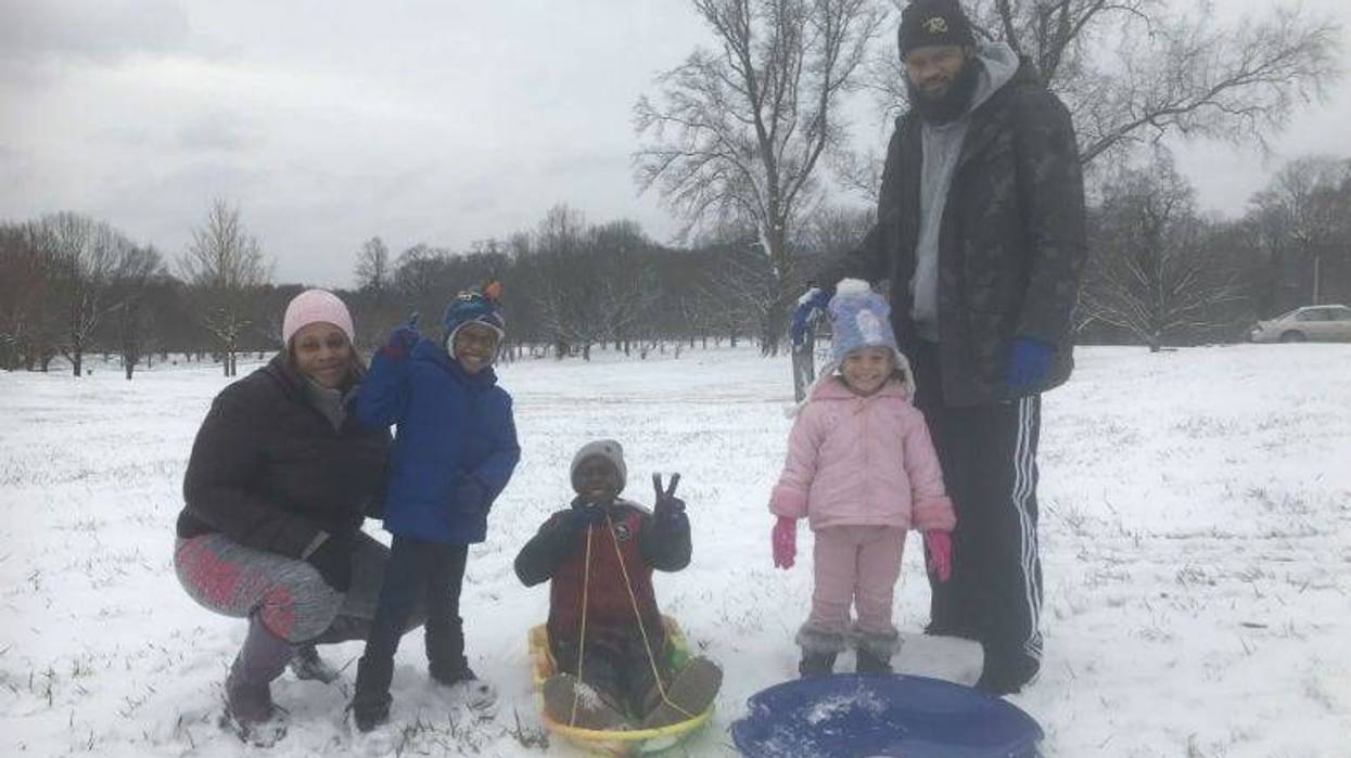 The Fassett family is ready for some fun in the snow at the Belmont Plateau.