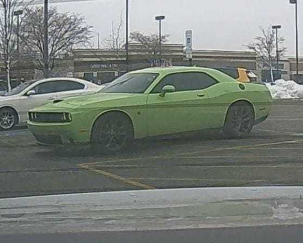 The FBI said the duo used this green Dodge Charger as a getaway car in the Monday robberies.