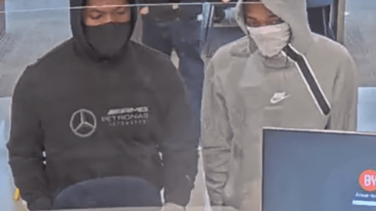 The FBI says this pair is wanted for robbing three Chicago-area banks on Monday. This photo shows them at a Byline Bank branch in Wilmette.