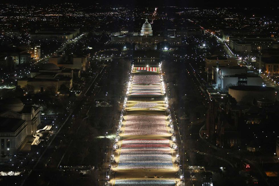The "Field of Flags" is illuminated on the National Mall as the U.S Capitol Building is prepared for the inauguration ceremonies for President-elect Joe Biden on January 18, 2021 in Washington, DC.