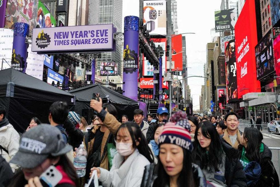 The first revelers arrive in Times Square 13 hours ahead of the New Year