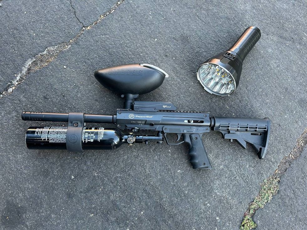 The flashlight and pepperball gun Julian Haper-Smith used on the would-be burglars.
