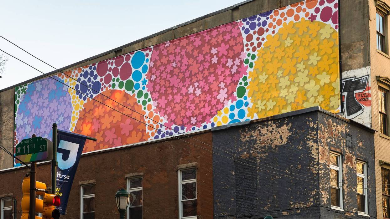 The "Floating Dogwood" mural by Michelle Tremblay and Polly Apfelbaum sits above Milkboy Philly, at 11th and Chestnut Streets.