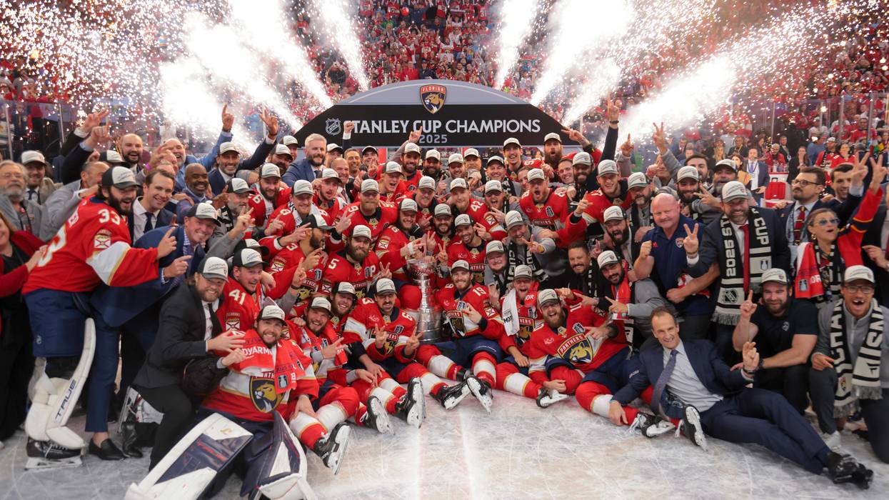 The Florida Panthers pose for a photo with the Stanley Cup